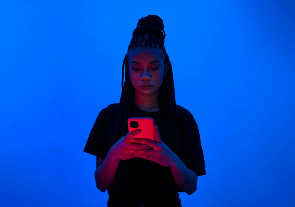 front view woman holding smartphone scaled